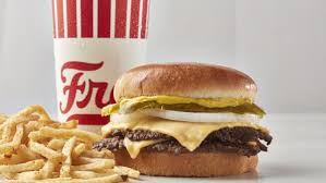Freddy's signature dishes Original Double Steakburger, Freddy's Famous Fry Sauce®, Shoestring Fries, Turtle Sundae or Concrete (Frozen Custard).